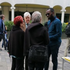 Matthew and John speaking to some people