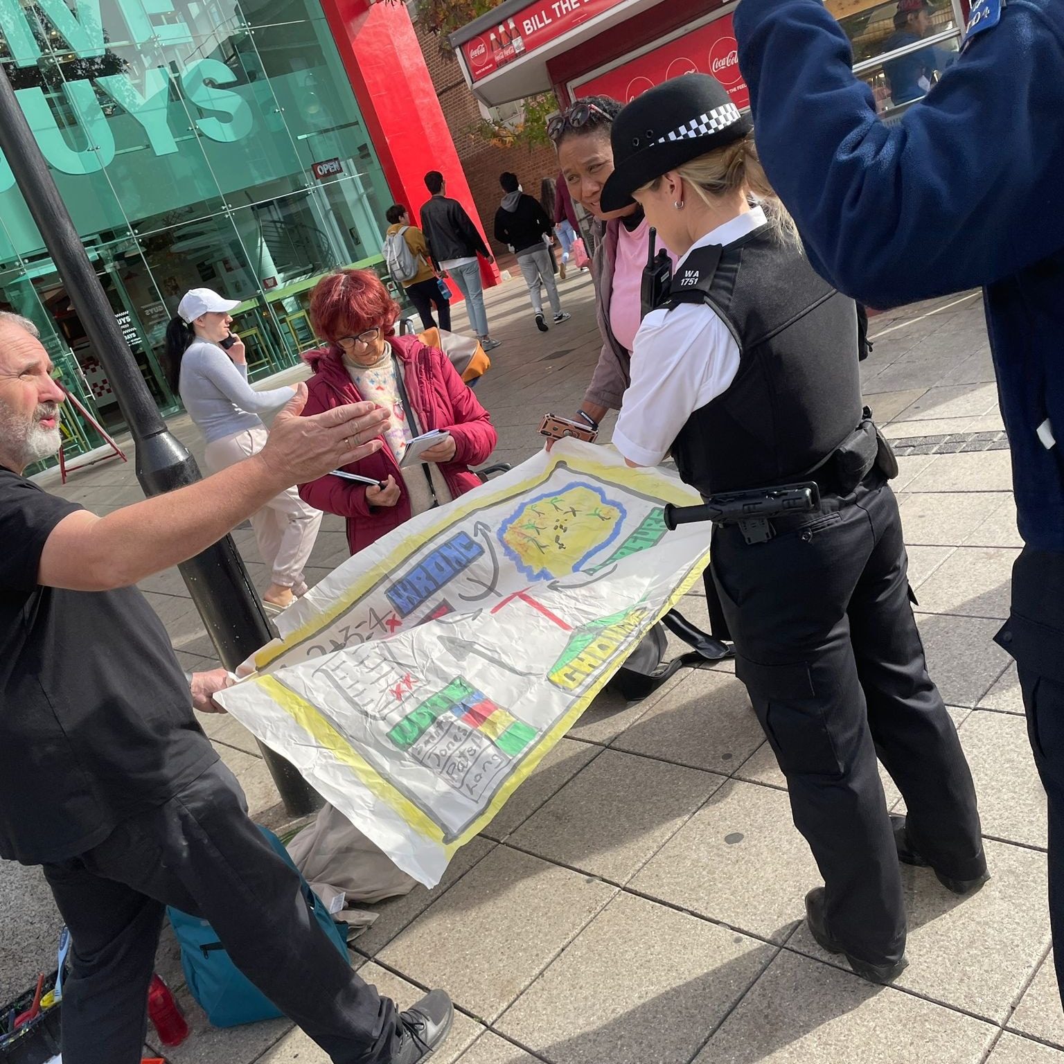 Kevin sharing the gospel with some police officers during the London Evangelism Mission