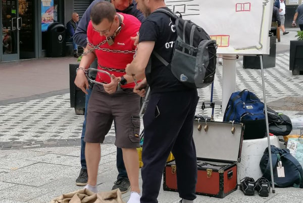 Steve being chained ready for sharing the gospel using escapology