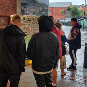 People speaking in an underpass