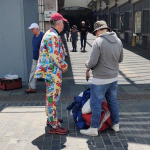 Steve Gurnett speaking to two men
