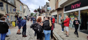 A crowd listening to a sketchboard in Truro