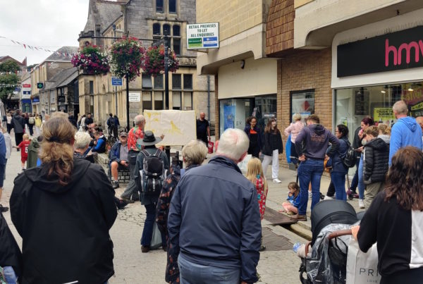 A crowd listening to Alan Jenner preach in Truro