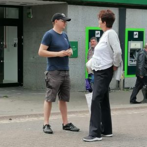 Steve Harris speaking to a lady