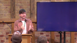 Jamie Parnell speaking at the Evangelists Conference 2024