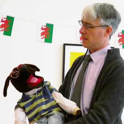 A picture of Adam Colman and his vent puppet Doug