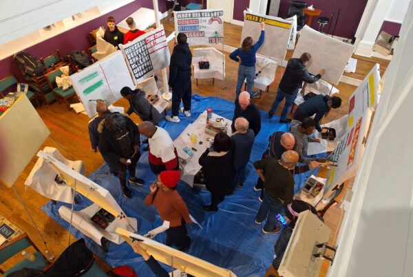 a number of people practising sketchboard painting