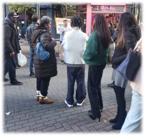 A man preaching the gospel on the streets using a sketchboard