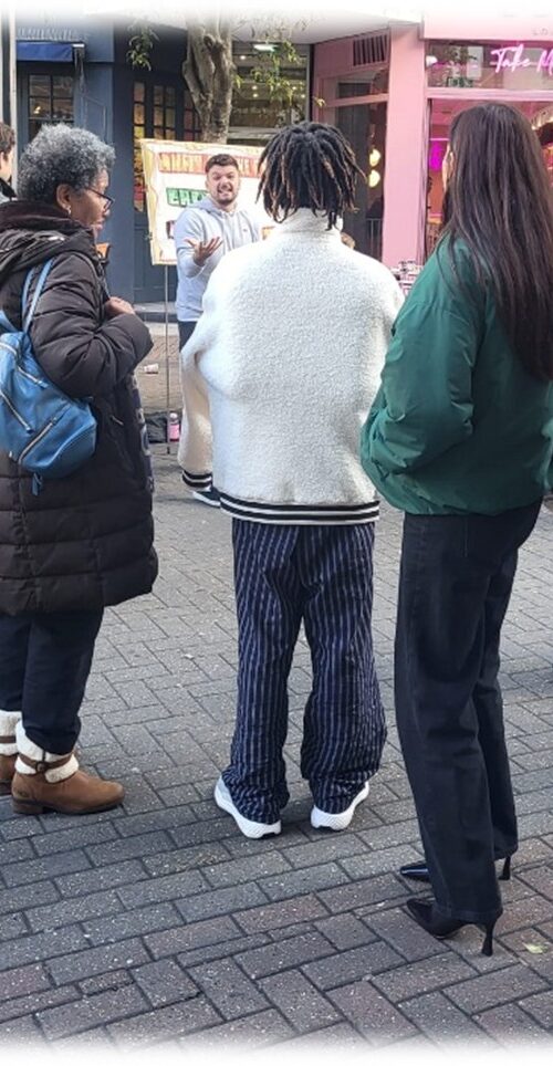 A man preaching the gospel on the streets using a sketchboard