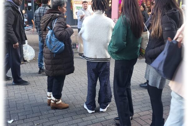 A man preaching the gospel on the streets using a sketchboard