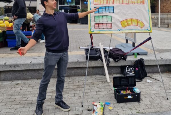 Edward preaching a sketchboard message outside a church