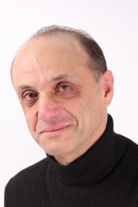 a headshot of Paul Alkazraji