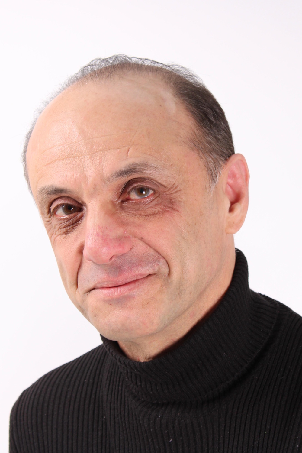 a headshot of Paul Alkazraji